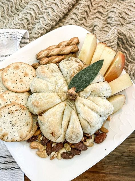 Warm and gooey pumpkin baked brie is an easy appetizer that you Baked Brie Sunflower, Pumpkin Baked Brie Puff Pastries, Apple Butter Baked Brie, Pumpkin Brie Appetizer, Pumpkin Brie Puff Pastries, Fall Baked Brie Appetizer, Fall Brie Appetizer, Fall Baked Brie, Baked Brie Pumpkin