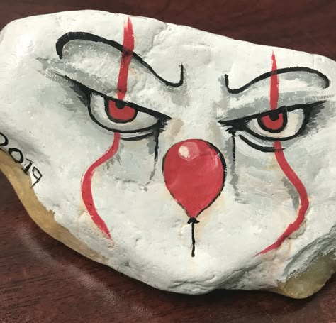 Pennywise Rock Painting, Spooky Painted Rocks, Horror Movie Painted Rocks, Dracula Painted Rocks, Halloween Pebble Painting, Scary Rock Painting, Horror Rock Painting, Sugar Skull Painting, Jack Skellington Faces