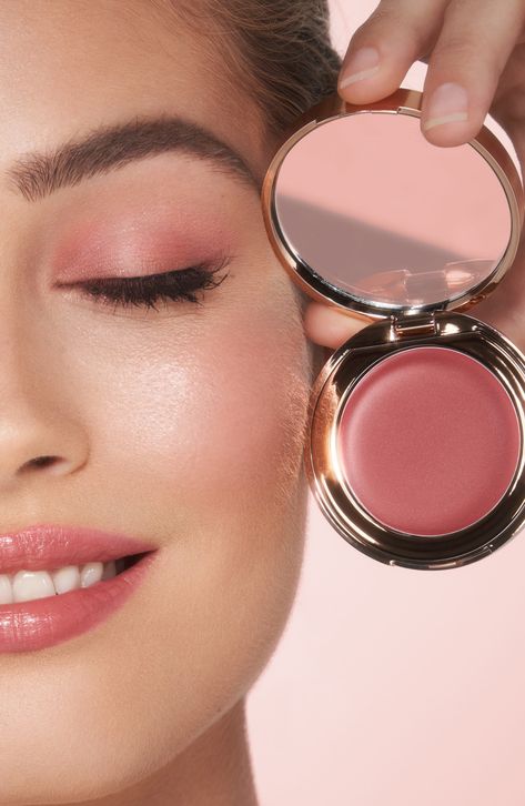 What it is: A hybrid lip-blush tint for weightless, buildable color. The easy-to-use cream formula glides on effortlessly for a dewy, sun-kissed glow.What it does: Charlotte's secret to sun-kissed skin in seconds. This multi-use, buildable product adds the perfect wash of color to the lips and cheeks. Infused with skin-loving ingredients like vitamin E and raspberry leaf stem cell extract, it moisturizes and revitalizes the look of skin. How to use: For a blush of color, apply to the apples of t Blush And Lipstick In One, Dewy Skin Aesthetic, Charlotte Tilbury Lip And Cheek Glow, Blush Photoshoot, Best Cream Blush, Charlotte Tilbury Blush, Blush Aesthetic, Blush Tint, Cosmetics By Brand