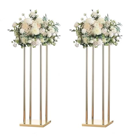 PRICES MAY VARY. UNIQUE AND ELEGANT DESIGN: Pack of 2 pcs Centerpieces, comes with modern style, it is gorgeous and makes your weddings, parties beautiful and unique. HIGH QUALITY METAL: The flower stand is made of high quality metal material which are durable and stable. MULTIPURPOSE: Match with flowers and artificial flowers, prefect for wedding table centerpieces, aisle road lead, party decorations, event decorations, it is also suitable for home décor, living room, coffee shop, bar, hotel. E Tall Wedding Arrangements, Tall Rose Centerpieces, Signing Table Flowers, Tall Floral Stands Wedding, Wedding Tall Centerpieces, Modern Rectangular Tall Metal Stand Wedding Centerpiece, Tall Centerpiece Wedding, Gold Wedding Flower Stand, Gold Floral Stand Wedding