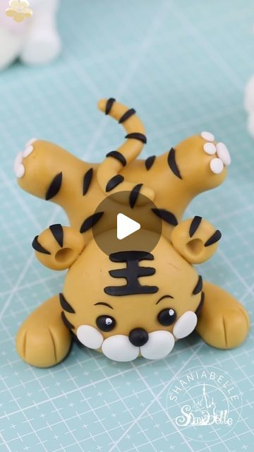 shaniabelle fondant on Instagram: "🐯How to make a tiger cake topper 🐯Gum paste from qeleg.com 🐯Feel free to contact me if you’re interested in any tools i have used.  Follow @shaniabelle_cake for more stunning cake ideas and hacks    #caketopper #tutorial #babyshowerideas  #inspirational  #genderreveal  #foodphotography #foodphotographyandstyling #reelsinstagram #foodgasm #tasty #dessert #video #inspiration #instagood #reels #cakeart #sugarart #cakeideas #LoveCelebration #BeautifulMoments #fondant #fondantcake" Tiger Cake Ideas, Tiger Fondant, Tiger Cake Topper, Tiger Cake, Fondant Figures Tutorial, Tasty Dessert, Video Inspiration, Fondant Toppers, Fondant Figures