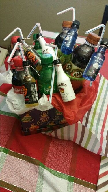 Mini alcohol bottles and mini soda bottles in a gift basket. Perfect as a gift to couples. Alcohol Gift Baskets, Mini Alcohol Bottles, Christmas Gift Baskets Diy, Liquor Gifts, Mini Liquor Bottles, Raffle Baskets, Cocktail Gifts, Drink Gift, Alcohol Gifts