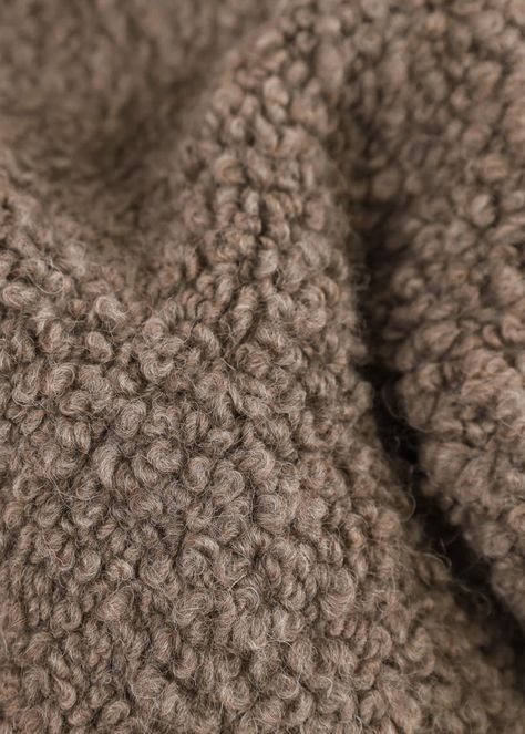 One of our favorite pieces to date. The Suri boucle throw is our softest and most luxurious throw. Made in Belgium out of alpaca and wool, the tight curly boucle texture is incredibly plush and cozy. The throw is dense, heavy in weight and made using traditional weaving techniques. Origin: Belgium Manufacturing: Woven Material: 45% Alpaca Wool, 44% Wool, 11% Cotton Colors: Mink, Umber, Ivory & Black Condition: New. Wear and inconsistencies are unique to the original item. Dimensions: Medium: 66. Rustic Fabric Texture, Fall Feeling, Wool Texture, Alpaca Throw, Sweater Ideas, Wool Textures, Suri Alpaca, Concept Board, Alpaca Fiber