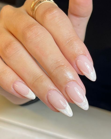 #pearlnails #frenchtipnails #frenchtipwithatwist #classynails #almondnails #biabnails #bridalnails #weddingnails #marblenails Almond Gel X French Tip, White French Tip Bridal Nails, Ivory French Tip Nails, Pearl White French Tip Nails, Pearl Tip Acrylic Nails, White Tip Nail Ideas, Bridal Nail Ideas Brides, Pearl Nails French Tip, French Tip Nails Wedding