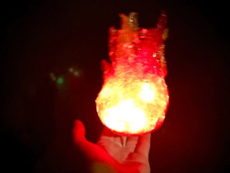 Make a glowing fireball that hovers above your hand. Attack your enemies by swinging your arm, and the fire flares up as your power surges. This is a very easy project that can add a lot of magic and fun interaction to your character. Flaming Shots, Fire Cosplay, Hades Costume, Fake Fire, Fire Torch, Witch Series, Super Mario And Luigi, Stationary Store, How To Make Fire