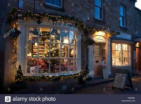 Download this stock image: Tisanes Tea Rooms at Christmas, Broadway, Worcestershire, England, UK - F93DMK from Alamy's library of millions of high resolution stock photos, illustrations and vectors. Broadway England, Christmas Display Window, Broadway Cotswolds, Window At Night, Tea Rooms, Uk Images, Front Windows, Christmas Tea, Christmas Display