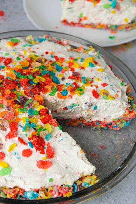 Fruity pebble pie with a slice taken out of it. Fruity Pebbles Cheesecake, Fruity Pebble Cheesecake, Easy Dessert Dips, Homemade Whipped Cream Recipe, Fruity Pebble, Fruity Pebbles Cereal, Rainbow Desserts, Homemade Strawberry Sauce, Crockpot Dessert Recipes