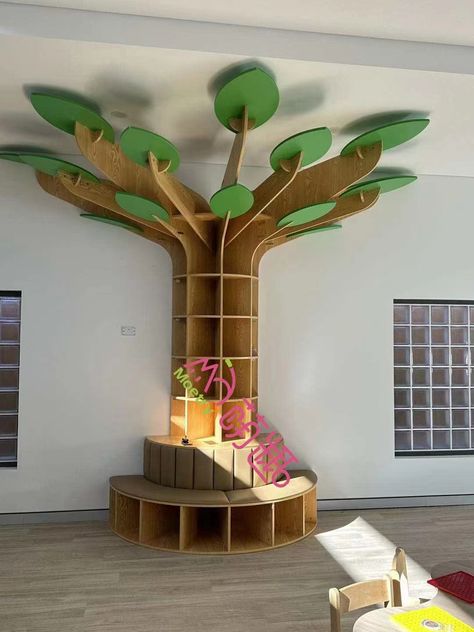 Kids Tree Bookshelf, Tree Shaped Bookshelf Diy, Library Book Shelf Design, Playroom With Bookshelves, Tree Library Bookshelves, Library Tree Display, Tree Bookshelf Nursery, Corner Tree Bookshelf, Diy Tree Bookshelf