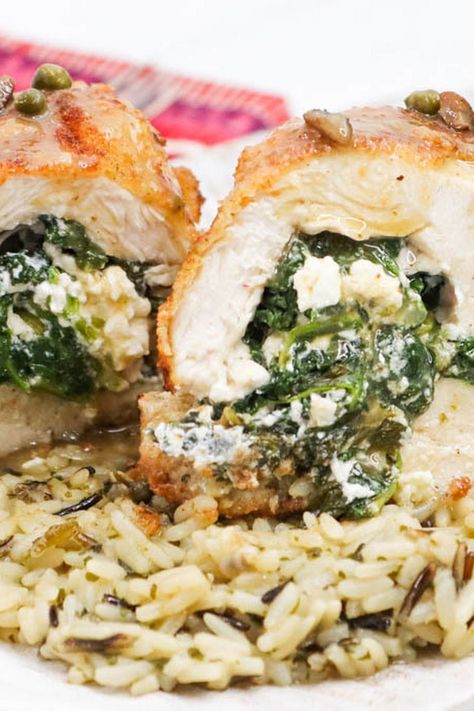 This recipe for Athenian chicken is a winner! It's a delicious way to enjoy chicken breasts with a Greek twist. Chicken is stuffed with a mixture of Feta cheese and spinach. Pan-frying the chicken before baking seals in the juices and the outside is crisp. Smooth and aromatic, the sauce is delicious and drizzled over the chicken when served. Hearty and satisfying, these chicken rolls are a fantastic meal. This dish has an impressive presentation and will wow friends and family before they even take a bite! Mountain Dew Apple Dumplings, Gooey Mac And Cheese, Garlic Herb Roasted Potatoes, Rolled Chicken Recipes, Herb Roasted Potatoes, Apple Dumplings, Just A Pinch Recipes, Chicken Rolls, Greek Chicken