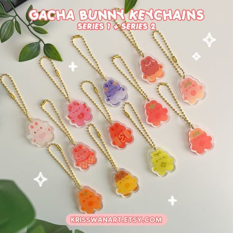 june mini update + gacha restock! ✨ the long requested bunny gacha keychain is finally back alongside a brand new fruity series! there’s also a sticker version of each design (these ones aren’t randomized; you are free to pick) i’ve also turned my big boots + tamagotchi stickers into cute matching keychains! available now link in bio or krisswanart.etsy.com 💖 #shopupdate #gachakeychain #bunnykeychain #matchingkeychain #acrylickeychain #bunnyart #bunnysticker #vinylsticker #cutearteveryday Shrinky Dink Keychain, Shrinky Dink Art, Diy Shrink Plastic, Big Boots, Crafts For Sale, Matching Keychains, Shrinky Dink, Manik Manik, Acrylic Keychains