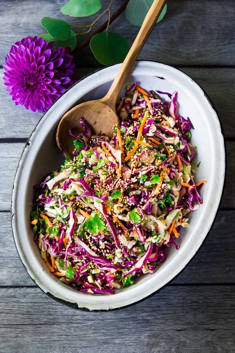 Easy Crunchy Asian Slaw- a simple vegan slaw with the BEST SLAW DRESSING EVER that can be made ahead! Serve this alongside fish, tofu, or chicken or stuffed into tacos, topped onto burgers, or added to buddha bowls. A great way to add more veggies into your everyday meals. #slaw #asianslaw #veganslaw #easyslaw #tacoslaw Asian Slaw Dressing, Vegan Slaw, Feasting At Home, Asian Dressing, Slaw Dressing, Vegan Coleslaw, Asian Slaw, Easy Asian, Slaw Recipes