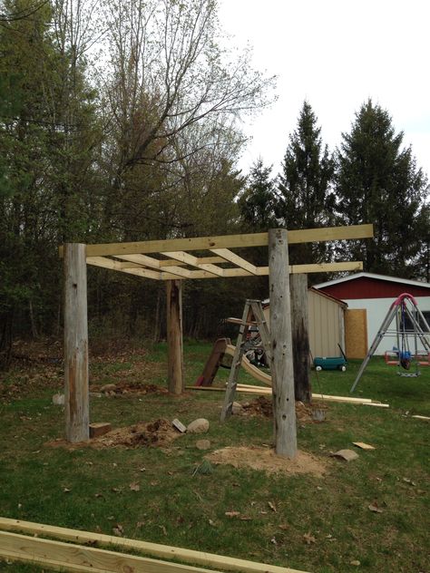 Deck Dog Pergola, Telephone Poles Projects, Telephone Pole Ideas, Telephone Pole Tree House, Goat Panel Deck Railing, Goat Spool Playground, Pond Dock With Gazebo, 1950s Ranch House, Log Art