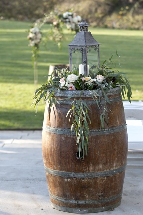 Lantern with hanging greens on wine barrel. Lori Makabe Photography. Wine Barrel Wedding Decor, Barrel Wedding Decor, Wedding Candy Cart, Wine Barrel Wedding, Wine Barrel Decor, Barrel Flowers, Whiskey Barrel Wedding, Barrel Wedding, Barrel Decor