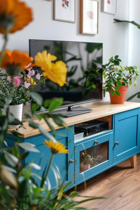 Refreshing Your Space: Painting TV Stand Ideas Tv Stand Decor Colorful, Minimal Tv Stand Paint, Colorful Tv Unit, Coloured Tv Unit, Painting Tv Stand Ideas, Painted Green Tv Stand, Colorful Tv Stand, Teal Tv Stand, Innovative Painting