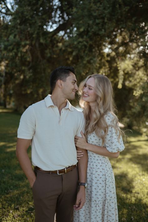 Antique Couples Photoshoot, Cream Engagement Outfits, Couple Poses With Dress, Elegant Couple Poses Photo Ideas, Couple Poses Reference Wedding, Sundress Couple Pictures, Engagement Photos With Dress, Couples Anniversary Photoshoot Poses, Neutral Couples Photoshoot Outfits