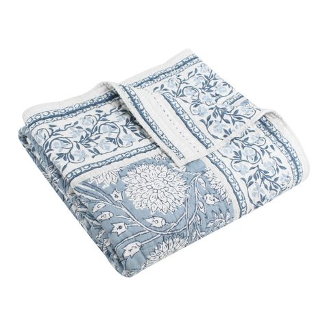 The Adare Blue Reversible Throw by Levtex Home is inspired by distinctive fashionable wall coverings. Offered in blue, navy and white, this design will immediately transform any room in your home. This throw features beautiful flowers in bloom and vines with a distinctive border all around on the front, reversing to a striped border floral vine design in blue on a white ground on the back. The Throw (50x60in.) has a cotton front and back, filled with a cotton-rich filler, and is machine washable. Enjoy this for years to come! Blue Bedspread Ideas, Blue And Green Quilt, Blue And White Bedding, Flowers In Bloom, Quilted Throw, Quilted Throw Blanket, Cozy Chair, Blue Throws, Vine Design