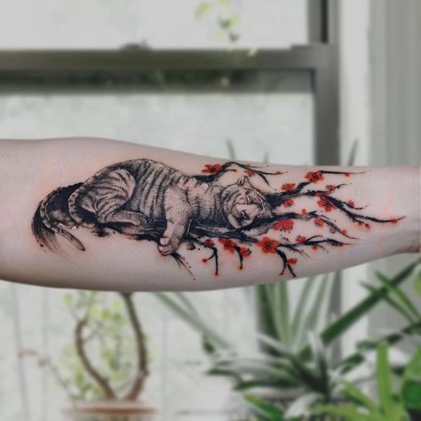 Cat | Peaceful tiger sleeping on a freehand brushstroke cherry blossom branch. Such a fun tattoo to work on and this tiger is a whole mood. To be... | Instagram Tiger Sleeping, Fun Tattoo, Blossom Branch, Cherry Blossom Branch, Brush Strokes, Cool Tattoos, Work On, Cherry Blossom, To Work