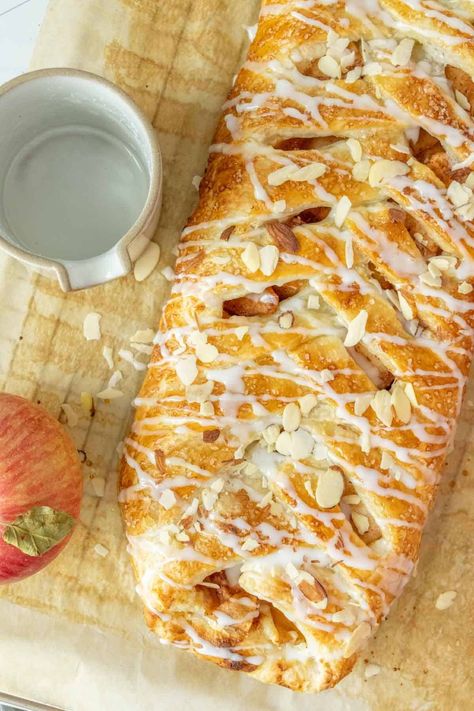 Filled with apples, cinnamon, and sweetened cream cheese, this delicious apple danish is perfect for a cozy fall breakfast or dessert. Apple Kringle Recipe, Apple Puff Pastry Recipes Cream Cheese, Apple Danish Puff Pastry, Apple Cheese Danish, Apple Cream Cheese Danish, Peach Danish, Apple Danish Recipe, Impressive Breakfast, Sweet Puff Pastry Recipes