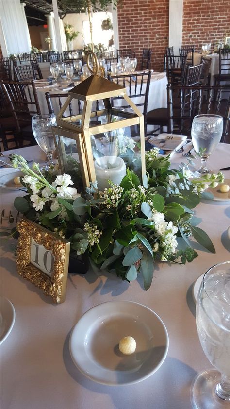 🌱 Greenery on circular tables? Costco garland, greenery mixes, etc | Weddings, Do It Yourself | Wedding Forums | WeddingWire Greenery Wedding Centerpieces, Lantern Centerpiece, Lantern Centerpiece Wedding, Greenery Centerpiece, Violet Wedding, Tafel Decor, Gold Lanterns, Lantern Centerpieces, Centerpiece Wedding