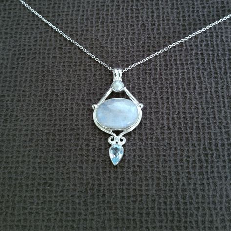 Brand New With Tags Shivam Rainbow Moonstone Pendant Necklace Excellent Condition With No Flaws Chain Length Approx 16" With 2" Extender Pendant Drop Approx 1-3/4" Width At Its Widest Point Approx 7/8" 925 Sterling Silver An Oval Shaped Rainbow Moonstone Sits Between A Tiny Round Freshwater Pearl And An Inverted Teardrop Shaped Light Blue Topaz Gemstone Made In India Please No Trades Or Lowballs! *Ask Any Questions You May Have Prior To Making An Offer Or Purchase Please* Moonstone Locket, Character Clothing, Moonstone Pendant Necklace, Style Reference, Rainbow Moonstone Pendant, Moonstone Necklace, Moonstone Pendant, Topaz Gemstone, Jewelry Inspo