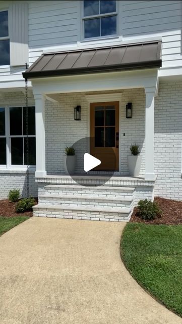 Kelly Jones on Instagram: "How do you feel about a real wood front door? This beautiful White Oak door from @simpsondoorco helped transform the front entry of this house in a big way!!!

#wooddoor #frontdoor #frontporch #homeremodel #paintedbrick #exteriordesign" Kelly Jones, Wood Front Door, Flip House, Oak Door, Most Asked Questions, Oak Doors, Painted Brick, Flipping Houses, Front Entry