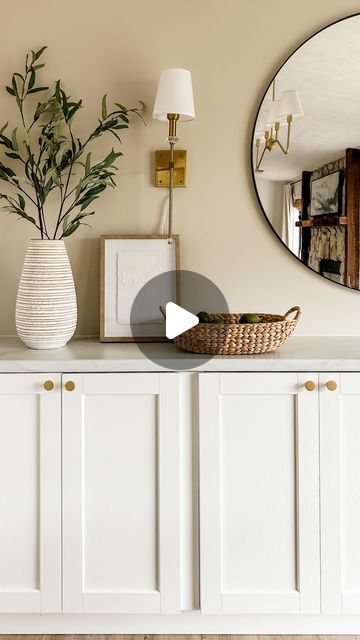 DeLancey Carson | Real, Relatable DIY on Instagram: "My first ever #ikeahack! These 15” deep IKEA cabinets were the perfect base for my dining room built-ins. 😍  Cabinets: @ikea Sektion Top: @formicagroup Calacatta Cava Wall color: @behrpaint Even Better Beige Mirror: IKEA Sconces: Amazon" Ikea Ersnäs Sideboard Hack, Dining Room Ikea Hacks, Ikea Dining Room Storage Ideas, Ikea Sektion Cabinets Hack, Dinning Room Cabinet Ideas, Ikea Buffet Cabinet, Dining Buffet Cabinet, Ikea Buffet Hack, Dining Room Buffet Built In