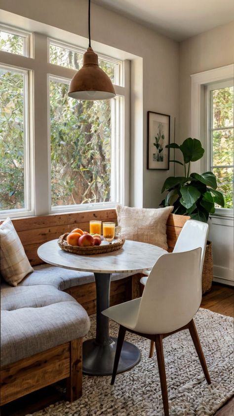 Transform your dining area with these 17 cozy breakfast nook ideas! From modern minimalist designs to charming rustic setups, find inspiration to create a warm and inviting space perfect for morning coffee or family meals. Breakfast Nook Dark Walls, Bistro Table Breakfast Nook, Mediterranean Breakfast Nook, Small Cozy Dining Area, Breakfast Nook In Front Of Window, Craftsman Breakfast Nook, Breakfast Nook No Windows, Small Kitchen Table With Bench, Dining Room Lounge Ideas