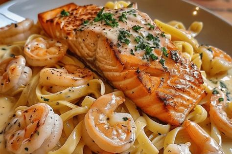 Indulge in this creamy Salmon and Shrimp Alfredo recipe. Rich seafood, tender pasta, and a luscious Alfredo sauce. Perfect for any dinner! Salmon And Shrimp Alfredo Pasta, Cajun Salmon And Shrimp Alfredo, Alfredo With Salmon, Seafood Alfredo Pasta, Salmon And Shrimp Recipes, Salmon And Shrimp Alfredo, Pasta Salmon, Seafood Alfredo, Shrimp Alfredo Recipe