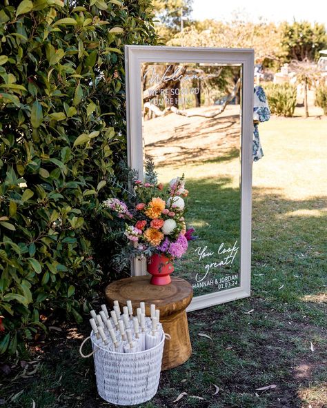 Give your wedding guests a warm welcome by ushering them into your garden wedding with a gorgeous mirrored sign. Hannah & Jordan also included pretty sun parasols for their beautiful sunny afternoon wedding. @ashhughesweddings #weddingmirror #gardenwedding #gardenweddingstyle #gardenweddingideas #geelongweddings #geelongbrides Backyard Wedding Welcome Sign, Simple Garden Theme Wedding, Garden Wedding Signs, Mirrors At Weddings, Garden Wedding Welcome Sign, Back Garden Wedding Uk, Wildflower Barn Wedding, Backyard Garden Party Wedding, Garden Wedding Ideas Receptions