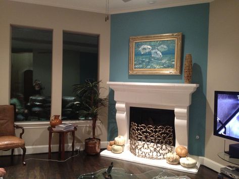 Fireplace accent wall complements painting. White Stone Fireplaces, Fireplace Accent Walls, Teal Accent Walls, Fireplace Feature Wall, Wooden Mantel, Accent Wall Ideas, Accent Wall Colors, Paint Fireplace, Victorian Fireplace