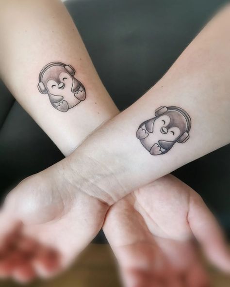 x If you’re looking for some inspiration, check out these awesome penguin tattoos: 1. Little Penguin Tattoo https://www.instagram.com/p/ChxtBxbJBQK/ A penguin wearing a batik T-shirt sound weird but you know, there is no limit for imagination. Go for this fun and creative tattoo. 2. Cool Penguin Tattoo  https://www.instagram.com/p/CcRtedmD45A/ The penguin above looks like a rock star, doesn’t he? If you are fond of rock music and style, you can turn your penguin into a rock star. 3. Pen Music Friend Tattoos, Best Friend Penguin Tattoo, Penguin Tattoo Small Couple, Matching Music Tattoos Couples, Cartoon Penguin Tattoo, Matching Music Tattoos Friends, Music Best Friend Tattoos, Couple Tattoos Music, Matching Penguin Tattoos Couples