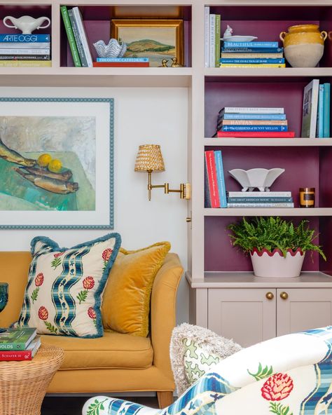 A modest home has been given a new lease of life by designer @seansymington with generous helpings of bold color, pattern and decorative flourishes. The living room exudes eclectic maximalism, with warm white walls contrasted against bright furniture and painted shelving. . Photography by @chriswakefield.photography . Tour the rest of this colorful house at the link in bio. . #homesandgardens #color #bookshelves Eclectic Maximalism Living Room, Warm White Walls, Maximalism Living Room, Painted Shelving, Modest Home, Painting Shelves, Eclectic Maximalism, Bright Furniture, Colorful House