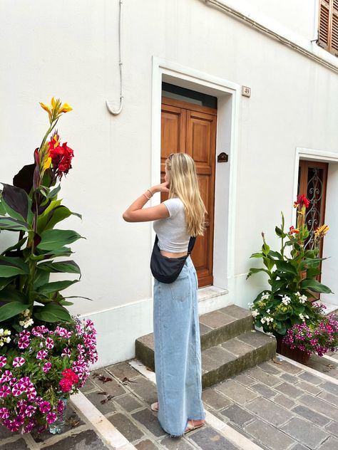 maxi denim skirt, grey top, uniqlo bag, italian architecture, plants, flowers Denim Skirt Outfit Fall 2024, Uniqlo Shoulder Bag Outfit, Uniqlo Round Mini Shoulder Bag Outfit, Uniqlo Dumpling Bag Outfit, Uniqlo Moon Bag Outfit, Uniqlo Bag Outfit, Mini Shoulder Bag Outfit, Dumpling Bag Outfit, Lisbon Outfit