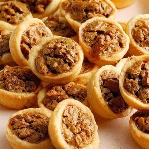 Pecan Tassies Recipe: How to Make It Pumpkin Tartlets, Pecan Tarts Mini, Tassies Recipe, Pecan Tarts Recipe, Blueberry Sweet Rolls, Finger Food Desserts, Pecan Tarts, Tarts Recipe, Dessert Spread