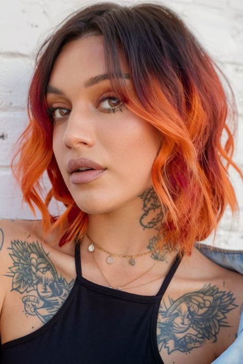 Turn heads this fall with a bold fire-orange ombre bob. This daring fall haircut features vibrant orange and red tones, seamlessly blending into dark roots. Perfect for those wanting to make a strong statement, this edgy style is ideal for the cooler months, adding warmth and vibrancy to any look. Orange Bob Hairstyles, Fire Ombre Hair Short, Orange Hair With Dark Roots, Red To Orange Ombre Hair, Copper Hair With Dark Roots Brown, Short Fall Hair Color Ideas, Fire Ombre Hair, Orange Ombre Hair, Orange Bob