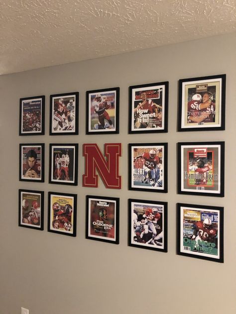 Sports gallery wall. Man cave Sports Photo Wall Display, Sports Picture Wall Ideas, Sports Room Decor Man Caves, Sport Gallery Wall, Man Cave Ideas Room Small Sports, Basement Sports Decor, Man Cave Sports Room, Sports Memorabilia Display Wall, Sports Basement Ideas