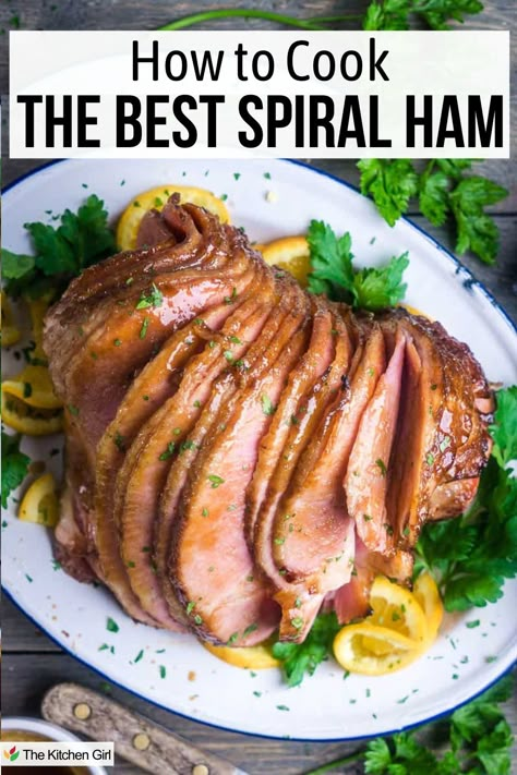 A plate of sliced spiral ham garnished with orange slices and parsley, accompanied by the text How to Cook the Best Spiral Ham. Sauce For Spiral Ham, Best Way To Cook Spiral Ham, Glaze For Fully Cooked Spiral Ham, How To Bake Spiral Ham In Oven, Spiral Cut Ham In Oven, Baked Spiral Ham Recipes Oven, How To Cook A Spiral Ham In A Roaster, How To Cook Spiral Ham In Crockpot, How To Cook A Spiral Ham