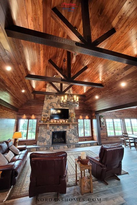 Stunning rustic living room by Nordaas Homes. This great room features a spectacular vaulted ceiling with timber beams, wood ceiling, stone fireplace, and wood flooring. Designed and built by Nordaas Homes. Living Room Wood Beams Ceiling, Wood Ceilings Living Room, Vaulted Wood Ceiling, Vaulted Ceiling With Wood Beams, Hacienda Kitchen Decor, Classic Ceiling Design, Hacienda Style Kitchen, Cathedral Ceiling Living Room, Vaulted Ceiling Beams