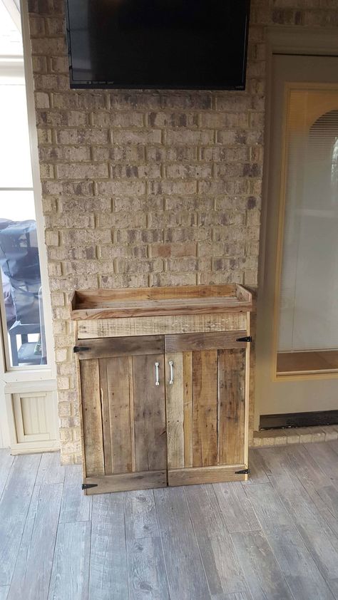 This project began as a simple shelf in our sunroom between the door to the kitchen and the door to our outdoor BBQ area. My wife decided it needed expanding. Still needs white washing to match our pallet wood coffee and matching end tables. P.S. I have received two orders for this same cabinet with minor variations.  #DiningRoom, #LivingRoom, #PalletCabinet, #PalletStorageIdeas, #RecyclingWoodPallets #PalletCabinetsWardrobes Diy Liquor Cabinet, Pallet Cabinets, Repurpose Pallets, Cabinet Woodworking Plans, Pallet Home Decor, Pallet Cabinet, White Washing, Outdoor Bbq Area, Pallet Headboard