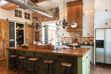 kitchen with brick backsplash and green cabinetry Brick Backsplash Kitchen, Rustic Kitchen Lighting, Colonial Kitchen, Southern Cottage, Country Kitchens, Brick Kitchen, Brick Backsplash, Farmhouse Kitchen Cabinets, Rustic Farmhouse Kitchen