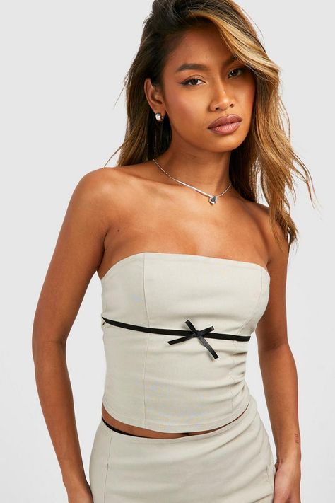 A closet staple that no collection is complete without, this tube top is officially your new fave style. A strapless design that features a bandeau neckline, this tube top for women accentuates the bust and hugs your figure in all the right places. For summer days, pair a white tube top with your fave mini skirt and sandals. Alternatively, a black tube top with classic mom jeans and an oversized shirt is a whole vibe. Style: BandeauFabric: BengalineNeckline: Bandeau White Tube Top, Black Tube Top, White Tube, Plus Size Romper, Black Tube, Bow Belt, Strapless Bandeau, Jeans Mom, Plus Size Prom Dresses