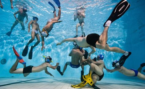 Underwater rugby is the ultimate test of strength, speed and swimming ability. Two teams of athletes battle it out in a pool to score goals with a weighted ball. Players use their endurance, strength and agility to beat the opposition and place the ball in a metal bucket on the floor of the pool. Underwater rugby is different from other contact sports as the opposition can attack from all sides, propelled by flippers. Underwater Hockey, Underwater Rugby, Pool Underwater, Metal Bucket, Miss America, Pictures Of The Week, Art References, Pose Reference, Rugby