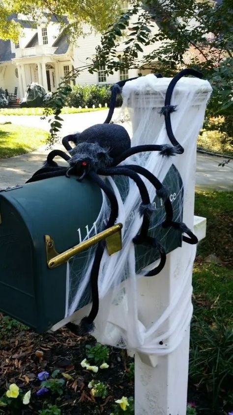 a black letter box on a pillar, with spiderweb and a large black spider is easy and fun Halloween decor that brings a Halloween feel Spider Egg Sack, Halloween Lanterns Diy, Spider Decor, Black Halloween Wreath, Scary Spider, Spider Wreath, Spiders Scary, Halloween Tablescape, Halloween Lanterns