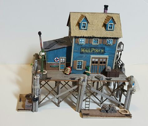 Staple to any eye-catching layout is some form of waterfront, be it a small stream, a raging river,… Flounder Fishing, Fishing Shack, Scale Model Building, Old Crates, Model Train Scenery, Model Railroading, Body Of Water, Model Train Layouts, Miniature Houses