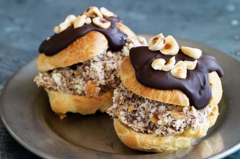 Give French profiteroles an Italian edge with a nutty filling and a hint of orange tang. Hazelnut Profiteroles, Pastry Cake Design, Profiteroles Recipe, Chocolate Ricotta, Choux Pastry, How To Roast Hazelnuts, Pastry Tart, Cream Puffs, Pastry Cake