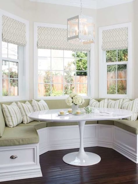 don't super love all the green, not as warm -but there is something appealing about this nook- the varying fabric and symmetry is appealing Bay Window Seating Kitchen, Bay Window Seating, Breakfast Nook Bench, Kitchen Bay Window, Nook Bench, Window Seat Kitchen, Seating In Kitchen, Window Seating, Banquette Seating In Kitchen