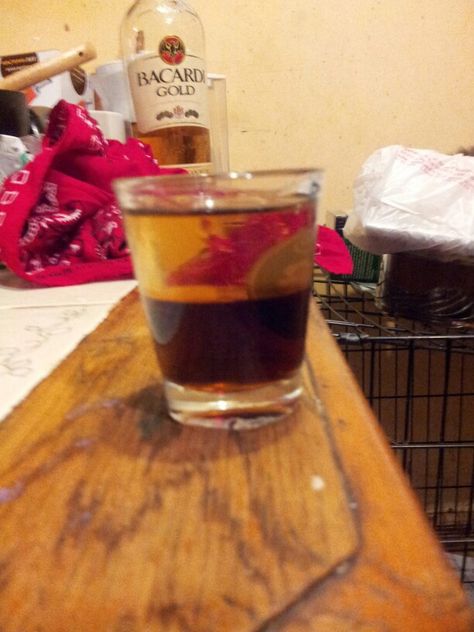 Bandana shot. Half Dr.Pepper half Bacardi Gold. Fill shot glass hlaf way with Dr. Pepper then lay a bandana on top of the pepper (single layer) then pour Bacardi on bandana the slowly pull the bandana away. Bacardi Gold, Bacardi, Dr Pepper, Shot Glass, Stuffed Peppers, Drinks, Tableware, Glass, Gold