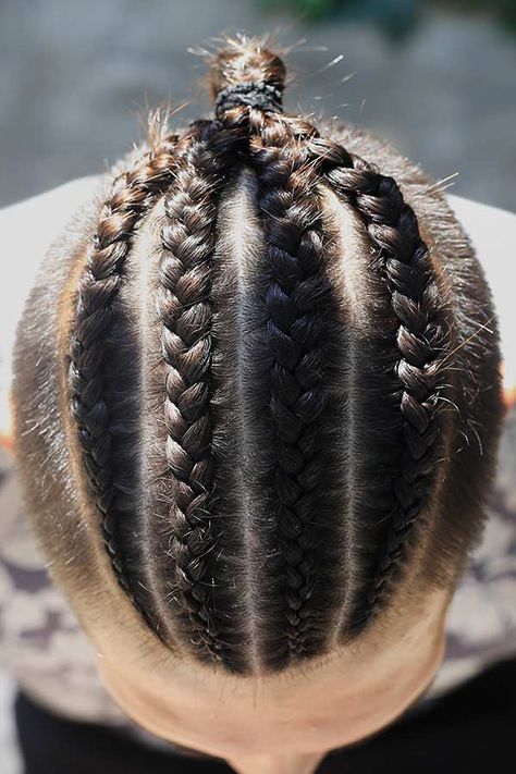 Four Cornrow Braids #undercut #manbraid #manbun #braidsformen #cornrows Want to try on man bun braids and looking for some inspiration? In our gallery, you'll find the most elaborate design ideas that suit everyone, from white to black men. Choose the style that matches your tastes and preferences, be it a short hair braided top knot or undercut cornrow bun. #menshaircuts #menshairstyles Trendy Cornrows, Man Bun Braids, Undercut Braids, Mens Ponytail Hairstyles, Cornrows Men, Long Undercut, Bun Braids, Braids With Fade, Braided Man Bun