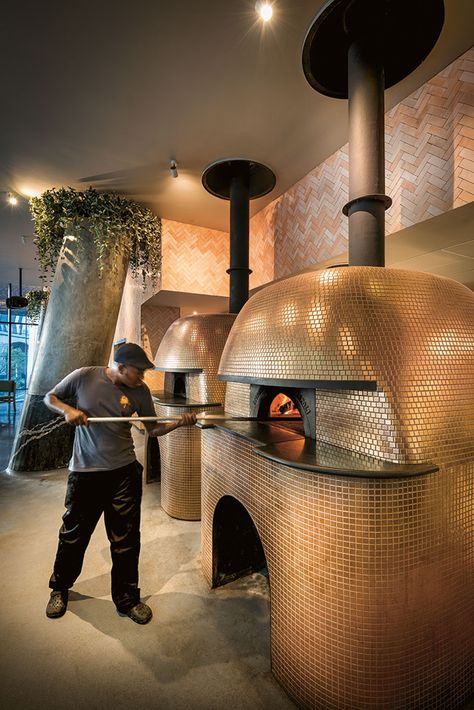 Two gigantic imported Stefano Ferrara pizza ovens, widely considered the Rolls-Royce of pizza ovens, are open to the restaurant. They have been clad ingold mosaics to add a theatrical aspectto the experience of dining at Saint. Pizza Oven Bar, Pizza Oven Restaurant Design, Wood Fired Pizza Oven Restaurant, Pizza Oven Mosaic, Pizza Restaurant Ideas, Wood Fired Pizza Restaurant, Pizza Restaurant Design, Pizza Oven Restaurant, Pizza Oven Design