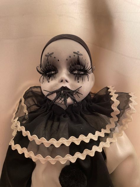 A bat-eating Pierrot Art Doll made from a vintage porcelain doll. This unhappy Clown Doll is one of a pair of clown dolls, but with a more sinister appetite. The doll is for decoration purposes only and comes with a supply of black balloons ready to be inflated. Porcelain Jester Doll, Porcelain Clown Dolls Vintage, Clown Doll Aesthetic, Pierrot Clown Art, Clown Dolls Vintage, Porcelain Doll Art, Porcelain Clown Dolls, Bat Eating, Porcelain Dolls Vintage